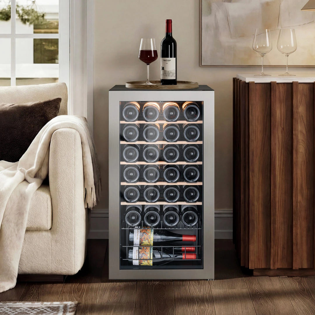 Under counter wine fridge placed in a living room setting, offering flexible placement beyond built-in installation.